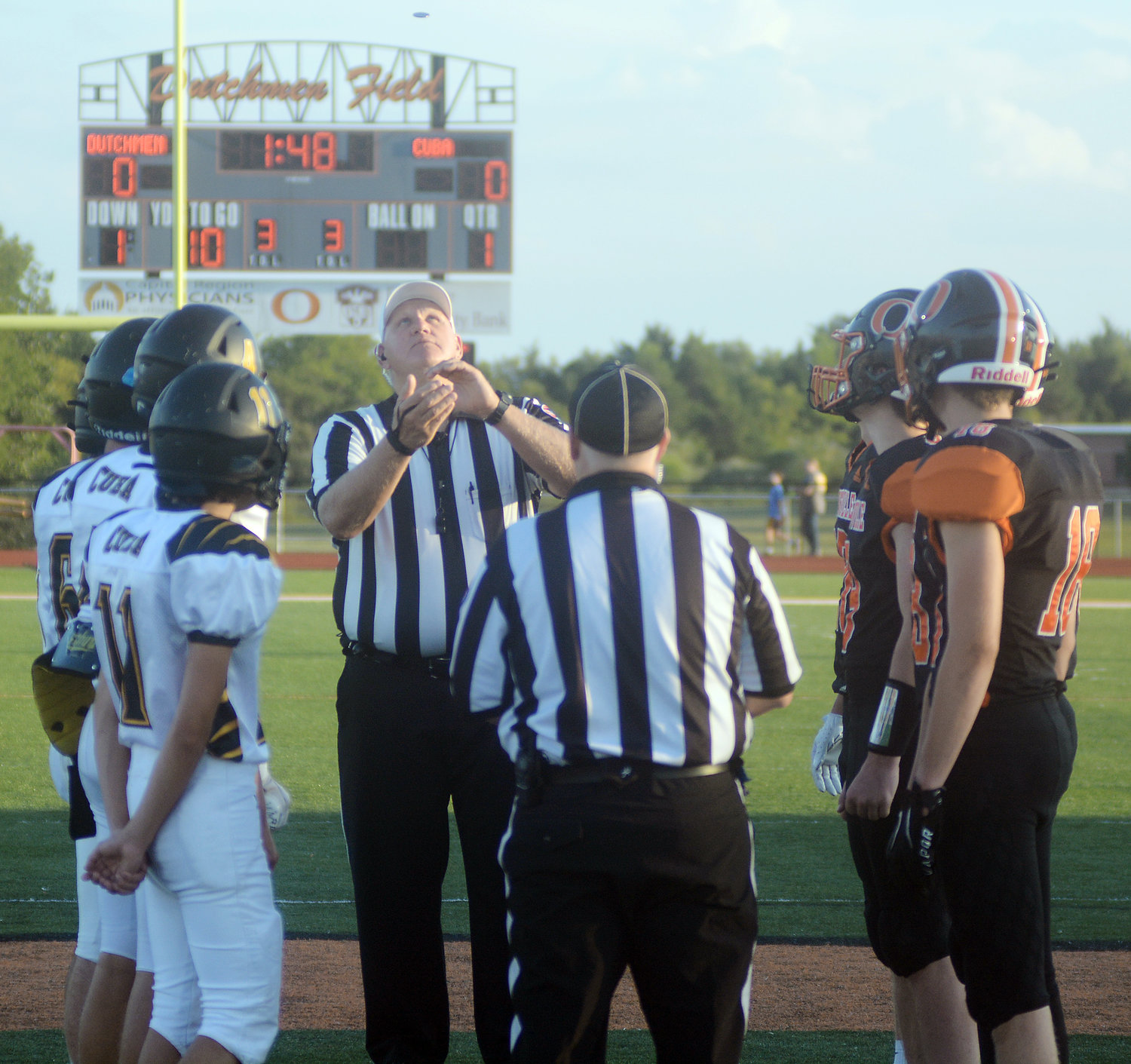 Captains for both the Cuba Wildcat and Owensville Dutchmen football teams watch the opening coin toss at midfield before the two teams squared off in a Highway 19 gridiron showdown.